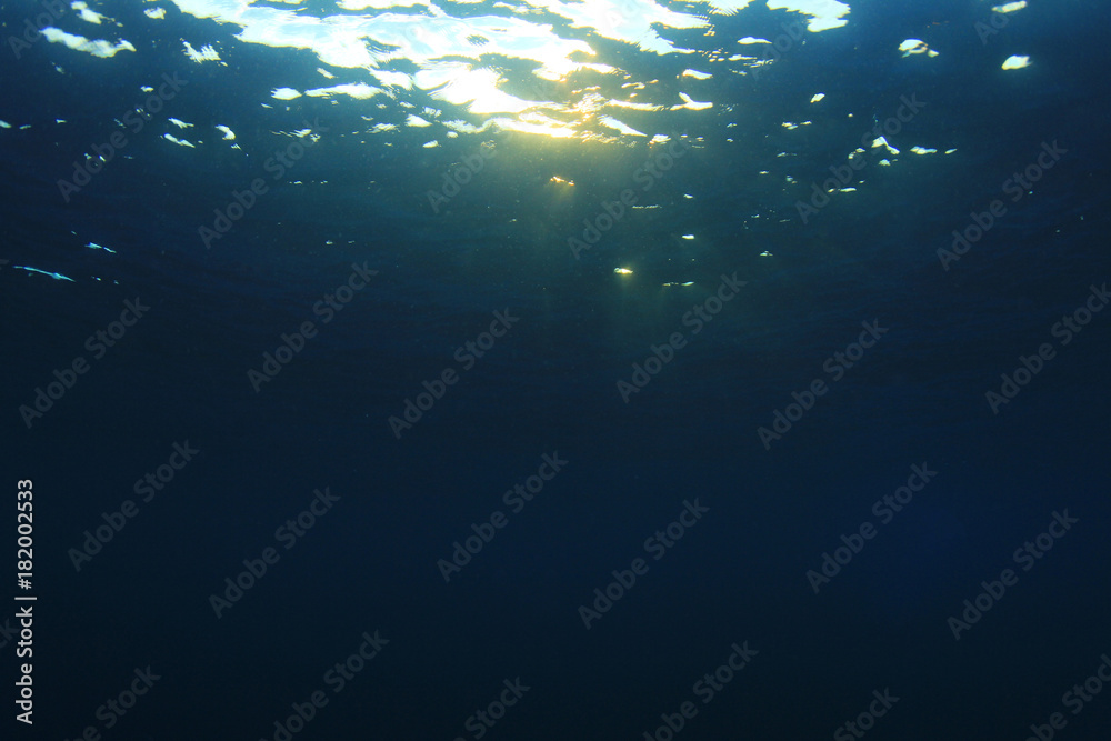 Underwater blue background and sunlight