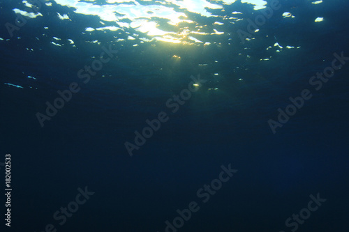 Underwater blue background and sunlight