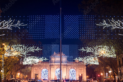 Christmas decorations in Madrid by night .