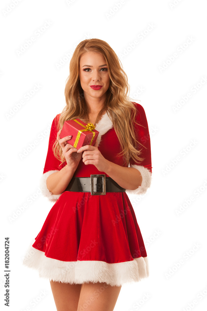 Beautiful blonde woman in santa claus dress holds a present for cristmas isolated over white Beautiful blonde woman in santa claus dress holds a present for cristmas isolated over white