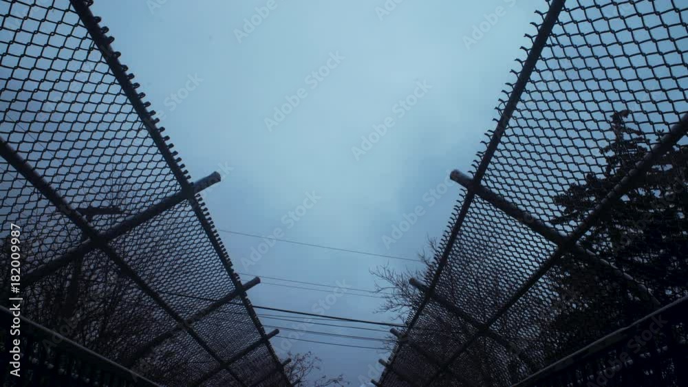 Wide shot of sky with chainlink fence. Cold winter day. Wide shot of sky with chainlink fence. Cold winter day.