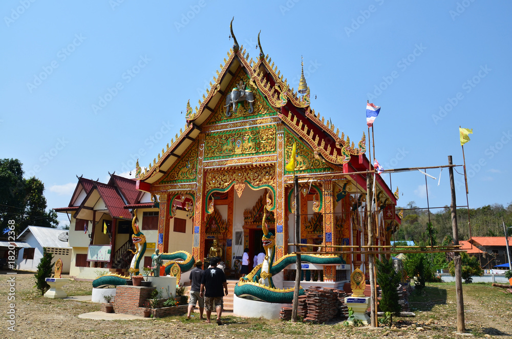 Travlers thai people go to Wat Don Moon temple for praying and respect Buddha statue inside Ubosot