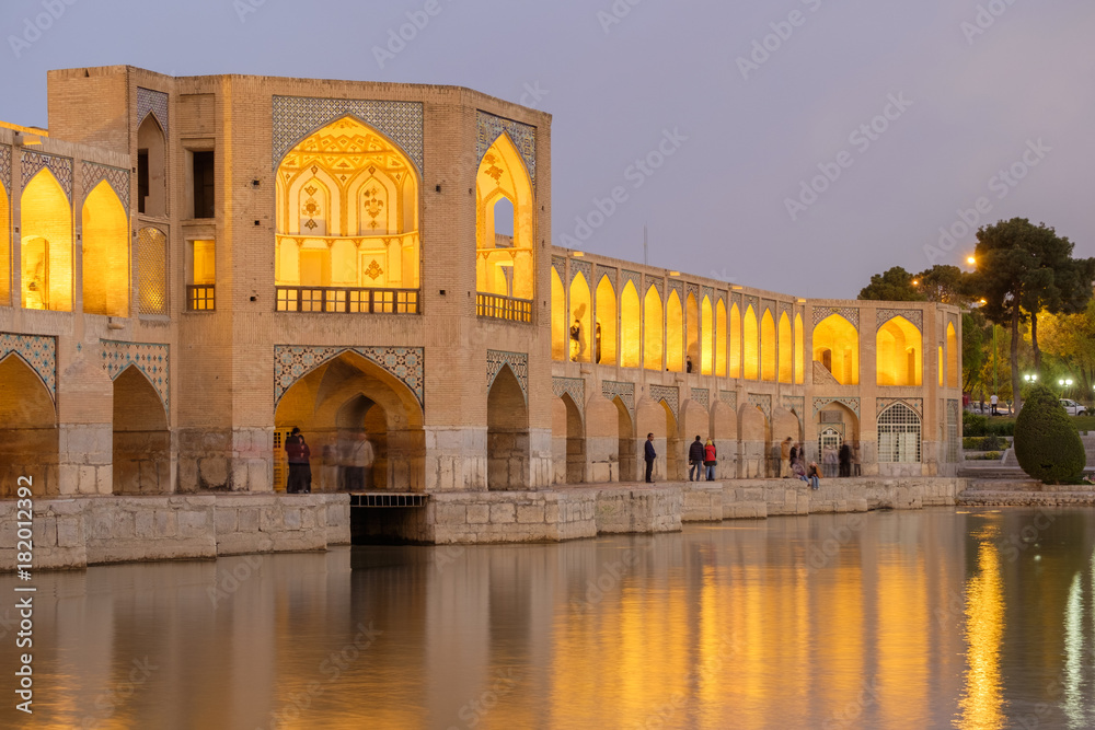 Iranian are rest at Pol-e Khaju bridge, 132 meter  long over Zayande river , since 1500 years ago, Esfahan, Iran