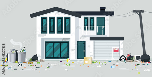 A deserted house full of trash with a gray backdrop.
