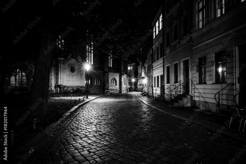 An ancient street in the historical quarter of Nikolaiviertel (Nicholas' Quarter). Berlin. Germany. Black and white.