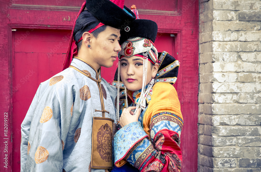 mongolian couple in traditional 13th century style outfits
