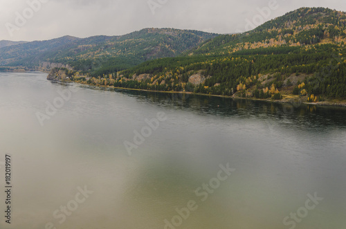Autumn landscape, golden forest, river, cloudy day