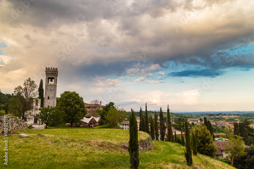 storm over an ancient and ruined castle in the italian countryside