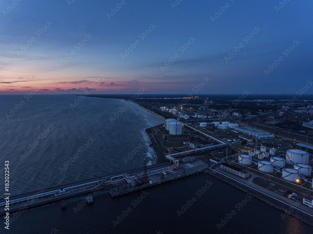 Aerial view over river Venta industrial part of Ventspils pier in Latvia.