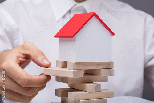 Businessman Balancing Property Sector