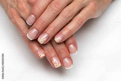 French manicure with painted daisies on small square nails