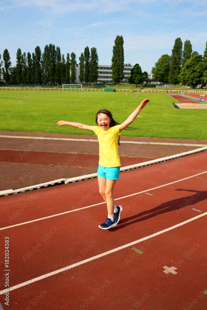 Little girl have fun on the stadium