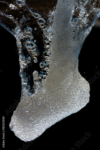 abstract shape of water, splashing on black background. Dreamlike vision and immagination.