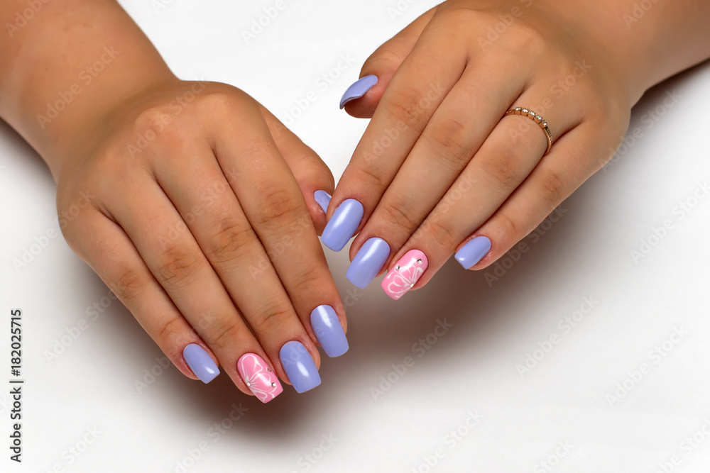 Delicate violet, pink manicure with white flowers and crystals on long square nails 