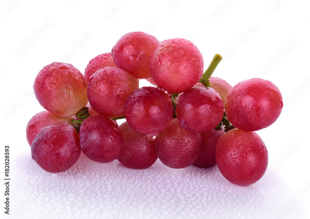 Red grapes and water drops isolated on white background