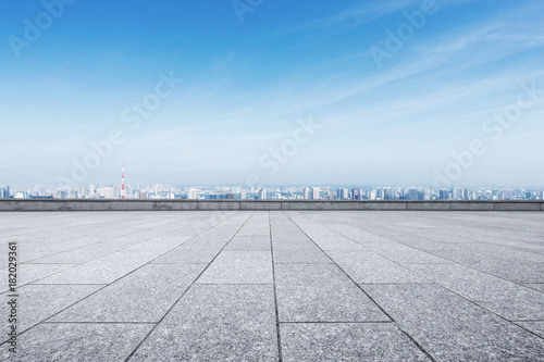 empty marble floor with modern cityscape
