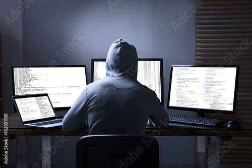 Hacker Using Multiple Computers For Stealing Data