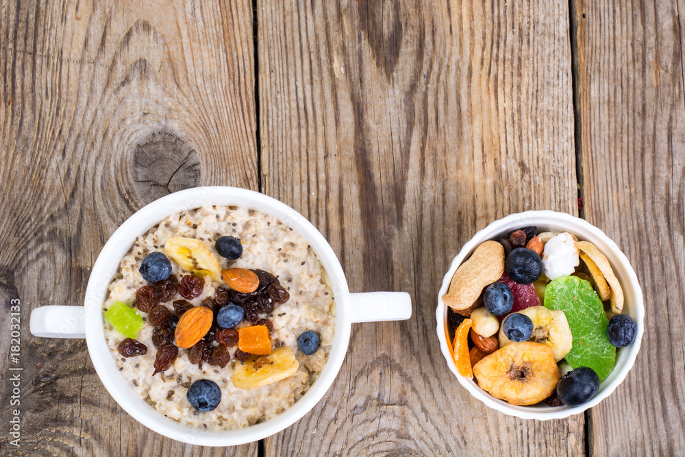 Oatmeal with fruit and nuts-hearty and tasty breakfast Oatmeal with fruit and nuts-hearty and tasty breakfast