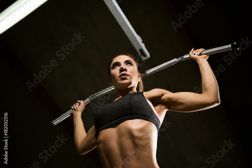 A girl trains in the gym.