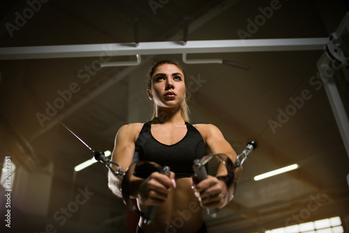 A girl trains in the gym.