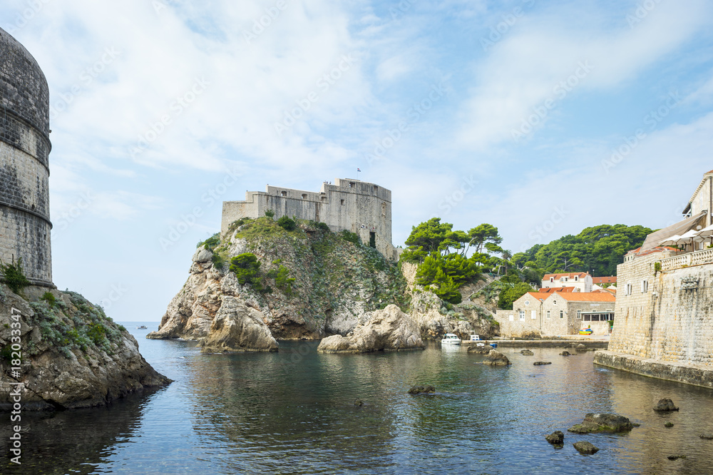 Scenic view of the turquoise Mediterranean waters surrounding the walled medieval city of Dubrovnik, Croatia