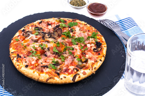 Pizza on black plate