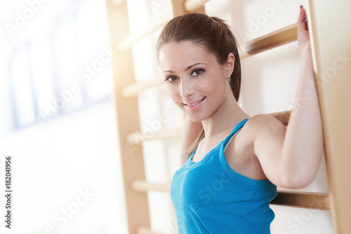Attractive smiling woman at gym Free Download Attractive smiling woman at gym - GFXLoad