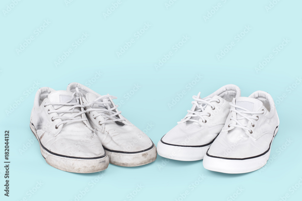 Pair of clean and dirty sneakers on turquoise background