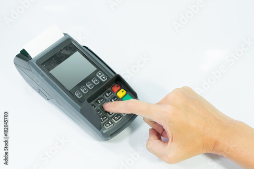 Hand paying for shopping online by secret code by credit card machine