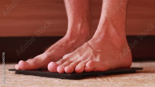 Wallpaper Mural Barefoot on scales with tape centimeter Torontodigital.ca