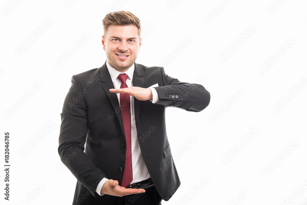 Attractive business man holding copyspace area Attractive business man holding copyspace area