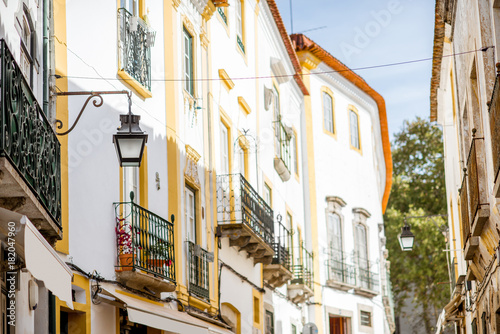 Street view with beautiful old residential buildings in Evora city in Portugal