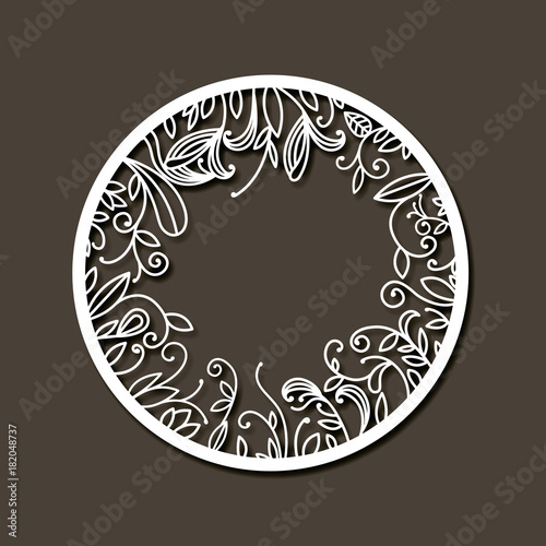laser cutting abstract round frame with internal decorations of branches with leaves in dark gray background