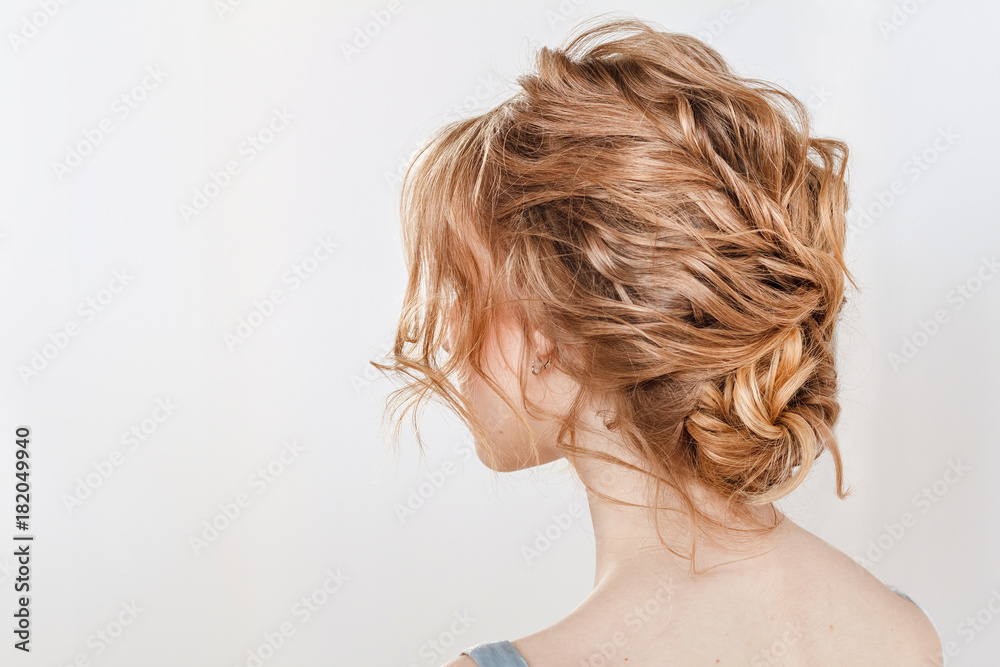 Rear view portrait of attractive young woman with beautiful wedding hairstyle and dress Rear view portrait of attractive young woman with beautiful wedding hairstyle and dress