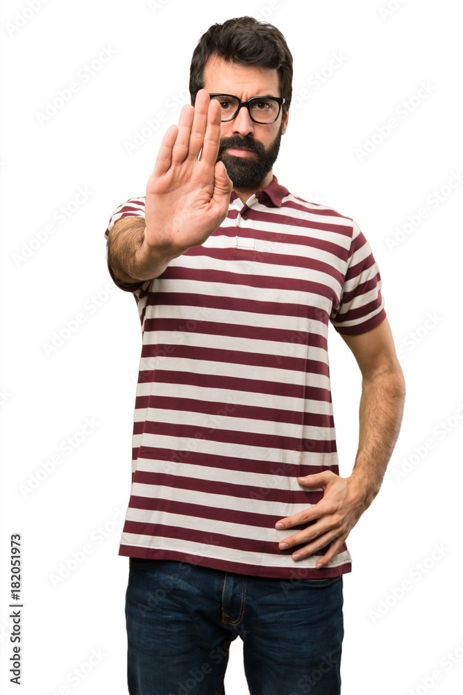 Man with glasses making stop sign