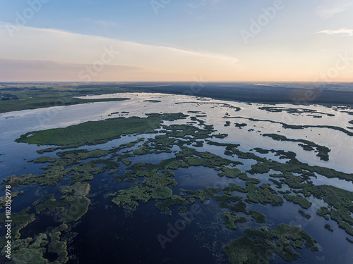 Aerial view over Zuvintas shallow lake Nature Reserve in Lithuania. During late summer evening. photo