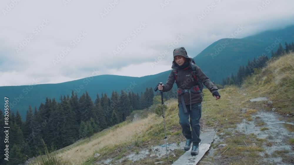 young caucasian female hiking in mountains young caucasian female hiking in mountains