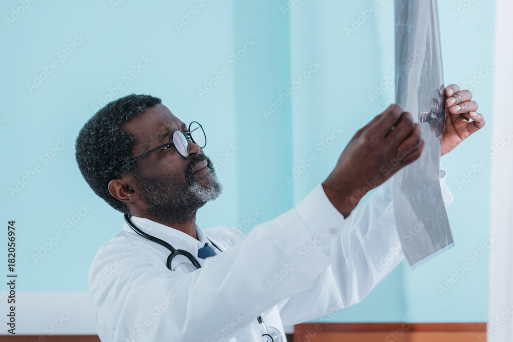 doctor looking at patient x-ray doctor looking at patient x-ray