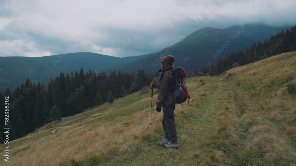 young caucasian female hiking in mountains young caucasian female hiking in mountains