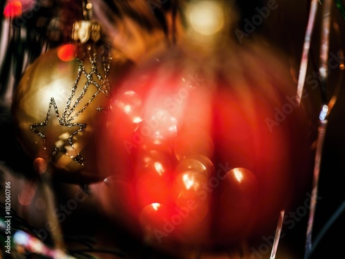 Two christmas decorative balls, red and golden.