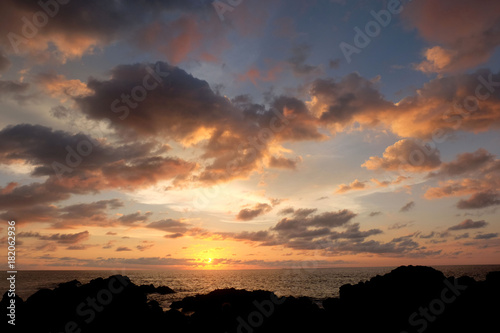 silhouette of island at the sunset