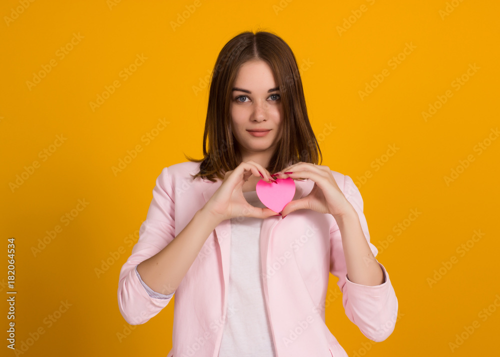 Yong cute girl with heart, isolated  