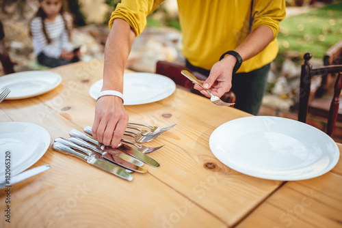 Close up photo of woman holding cutlery