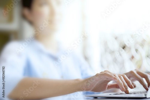 Hand woman is typing on a keyboard to work or shopping online.