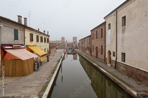 Comacchio (Italy) - Characteristic and fascinating historic town in the Park of the Po Delta, Comacchio has a maze of canals with small bridges and pastel-coloured houses.