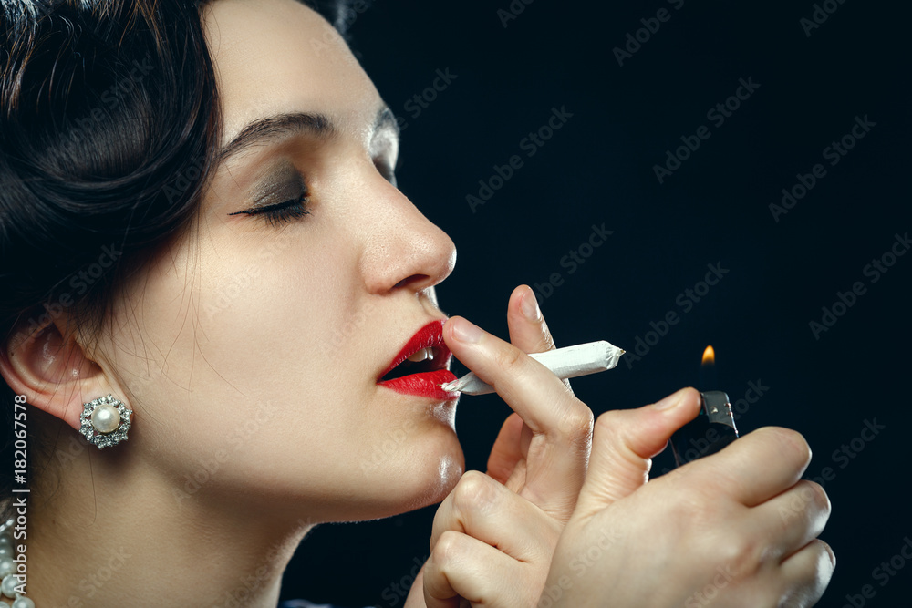 Fototapeta premium woman smoking joint