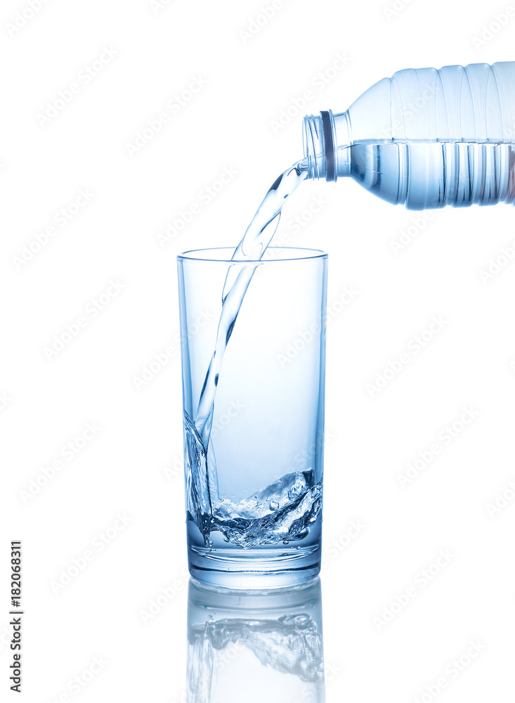 pouring water on a glass isolated on white background pouring water on a glass isolated on white background