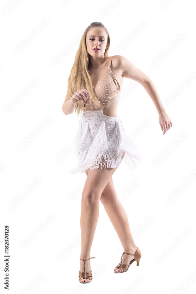 Attractive professional caucasian female latino dancer dancing in fringed dress. Full body length portrait isolated on whit background.