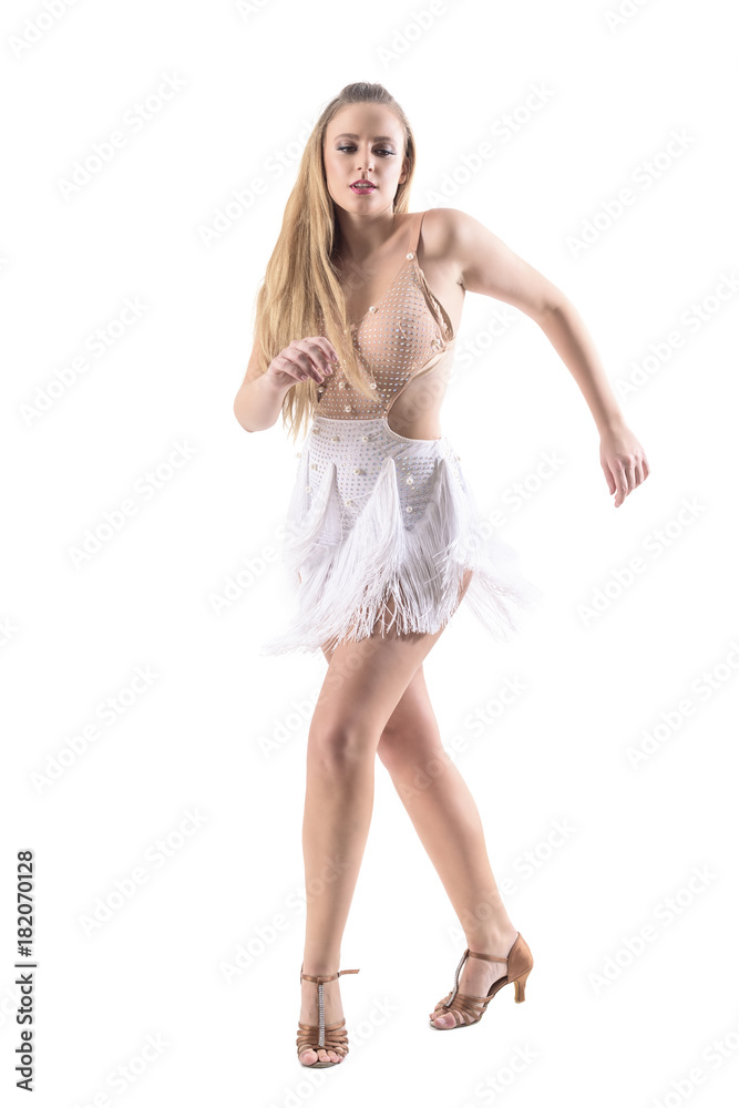Attractive professional caucasian female latino dancer dancing in fringed dress. Full body length portrait isolated on whit background. Attractive professional caucasian female latino dancer dancing in fringed dress. Full body length portrait isolated on whit background.