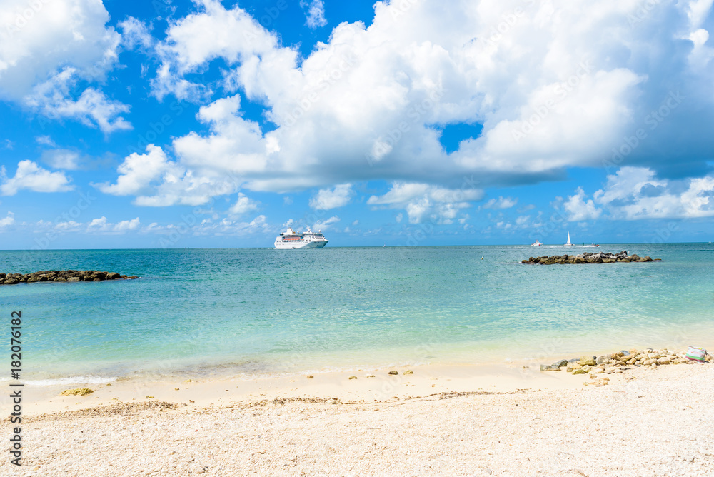 Cruise ship on Caribbean Sea close to paradise beach. Tropical travel concept and destination for vacation. Recreation and relaxing. Cruise ship on Caribbean Sea close to paradise beach. Tropical travel concept and destination for vacation. Recreation and relaxing.